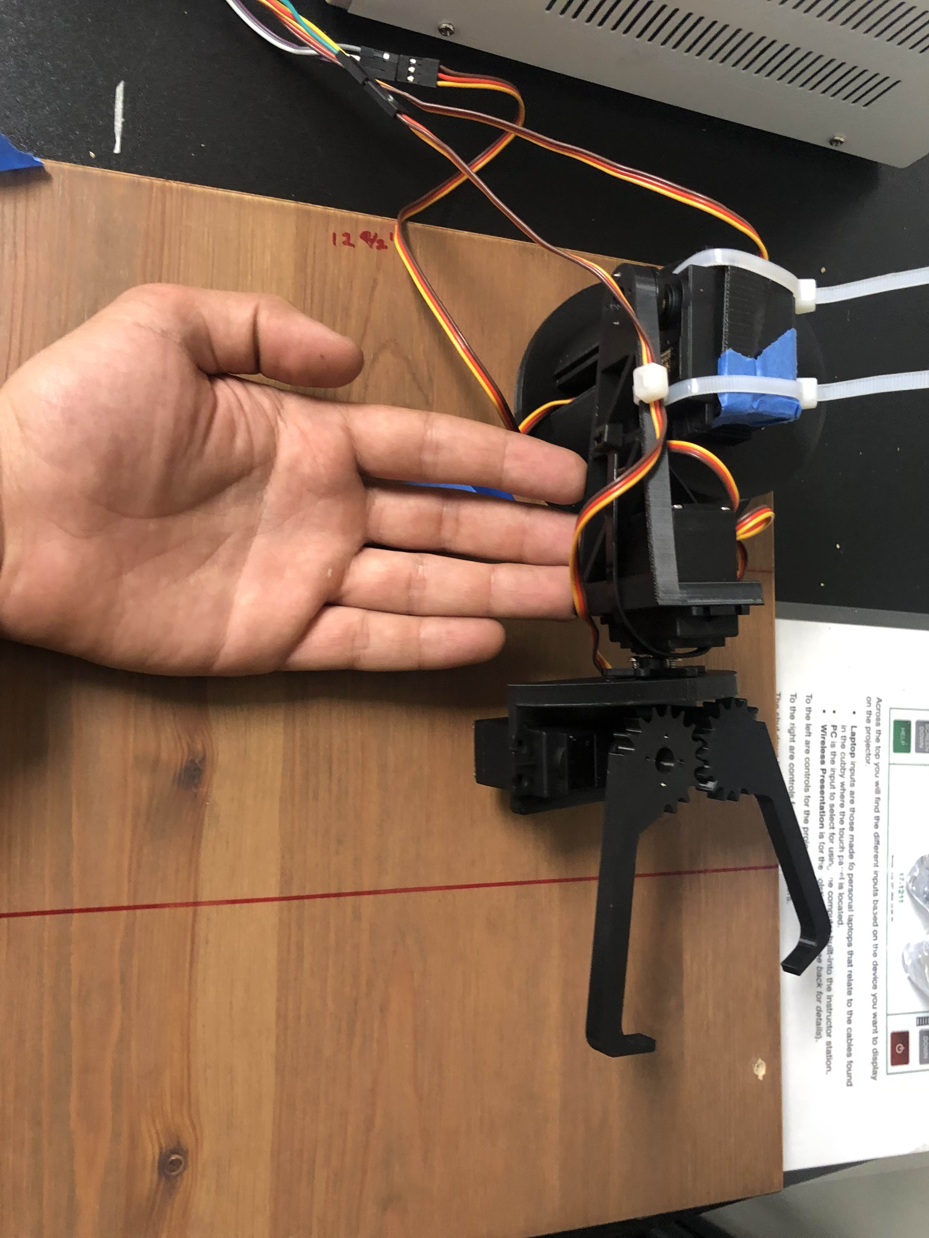 Close-up of the geared claw gripper and MG995 servo on the Can Arm